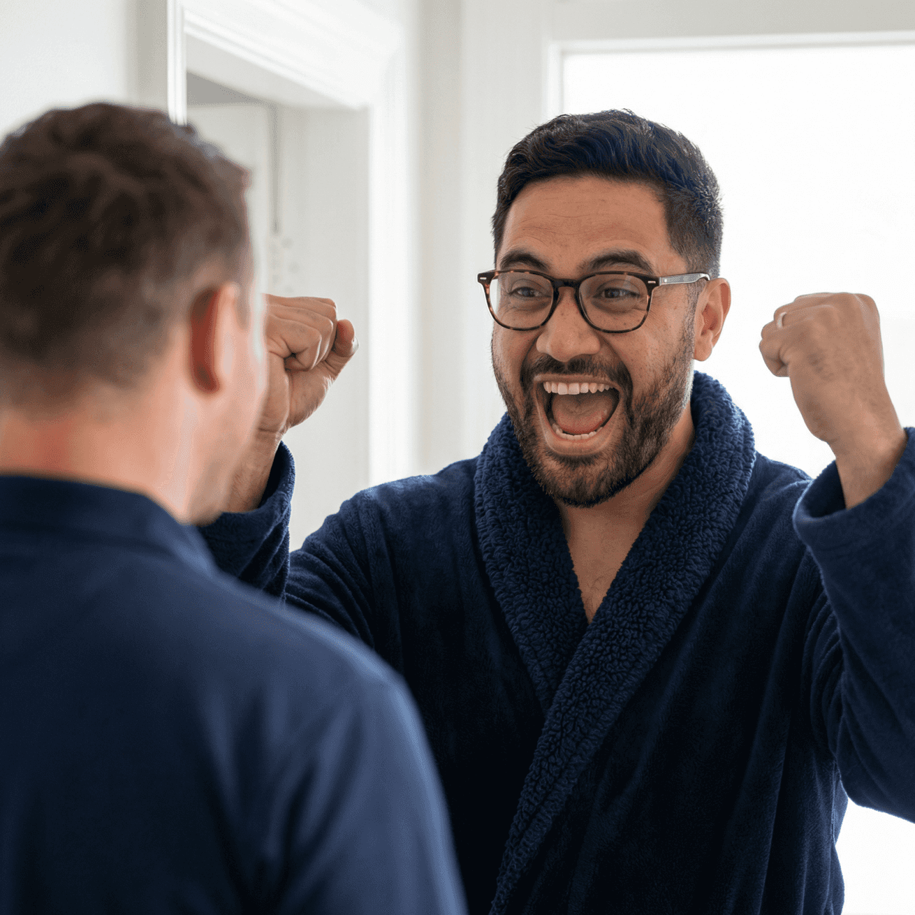 Homeowner celebrating with solar installer at front door