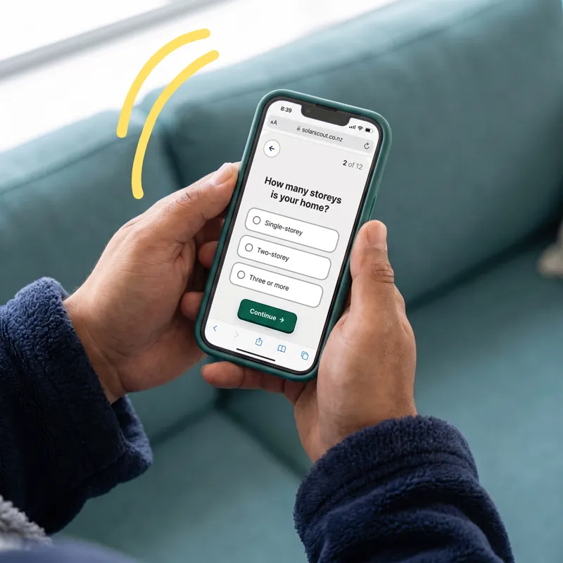 A homeowner on the sofa answering a quiz question about their home on a phone
